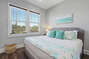 3rd Bedroom with Teal Furnishings and Queen Bed
