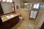 Bed-2 en-suite bath with walk in travertine shower