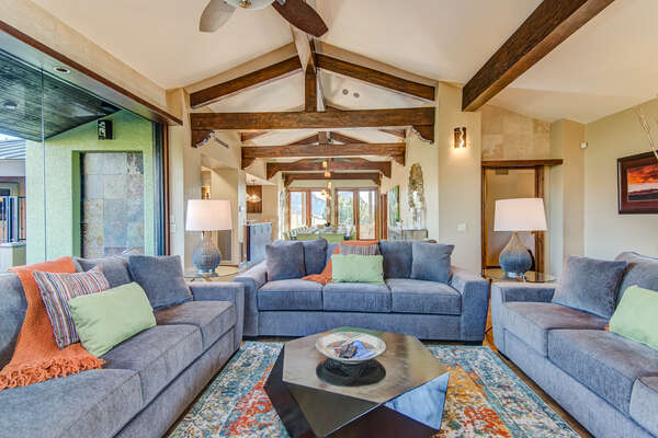Main Level Living Room with Vaulted Wood Beam Ceilings