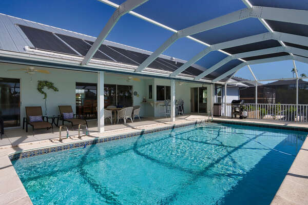 Private heated pool with loungers and dining table