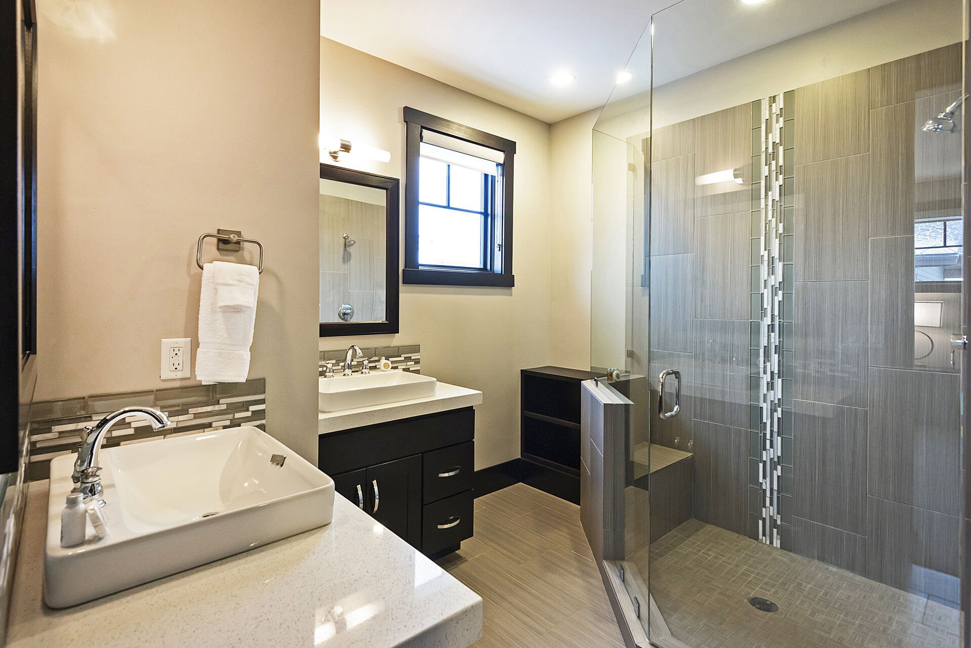 Master Bath with Dual Vanities and a Tile Shower
