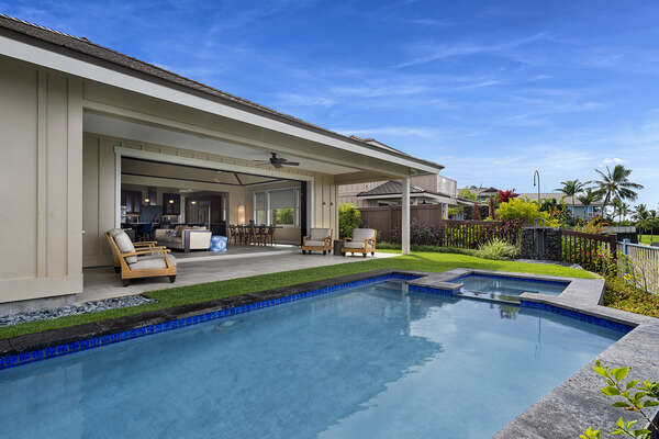 Relaxing outdoor space with a private pool and cushioned seating.
