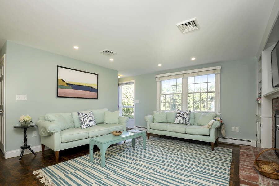 The living room's cool colors are inviting at 40 Tip Cart Chatham Cape Cod - New England Vacation Rentals