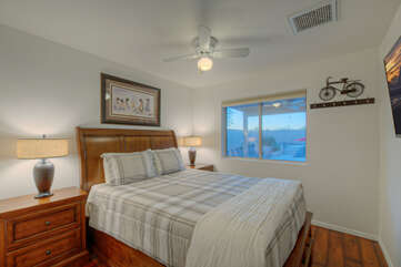 The second bedroom invites quiet and comfortable repose.