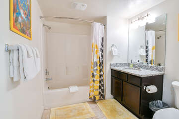 Second bathroom with a bathtub and one sink
