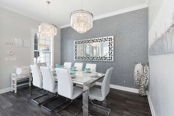 The formal dining table seats up to 8 guests