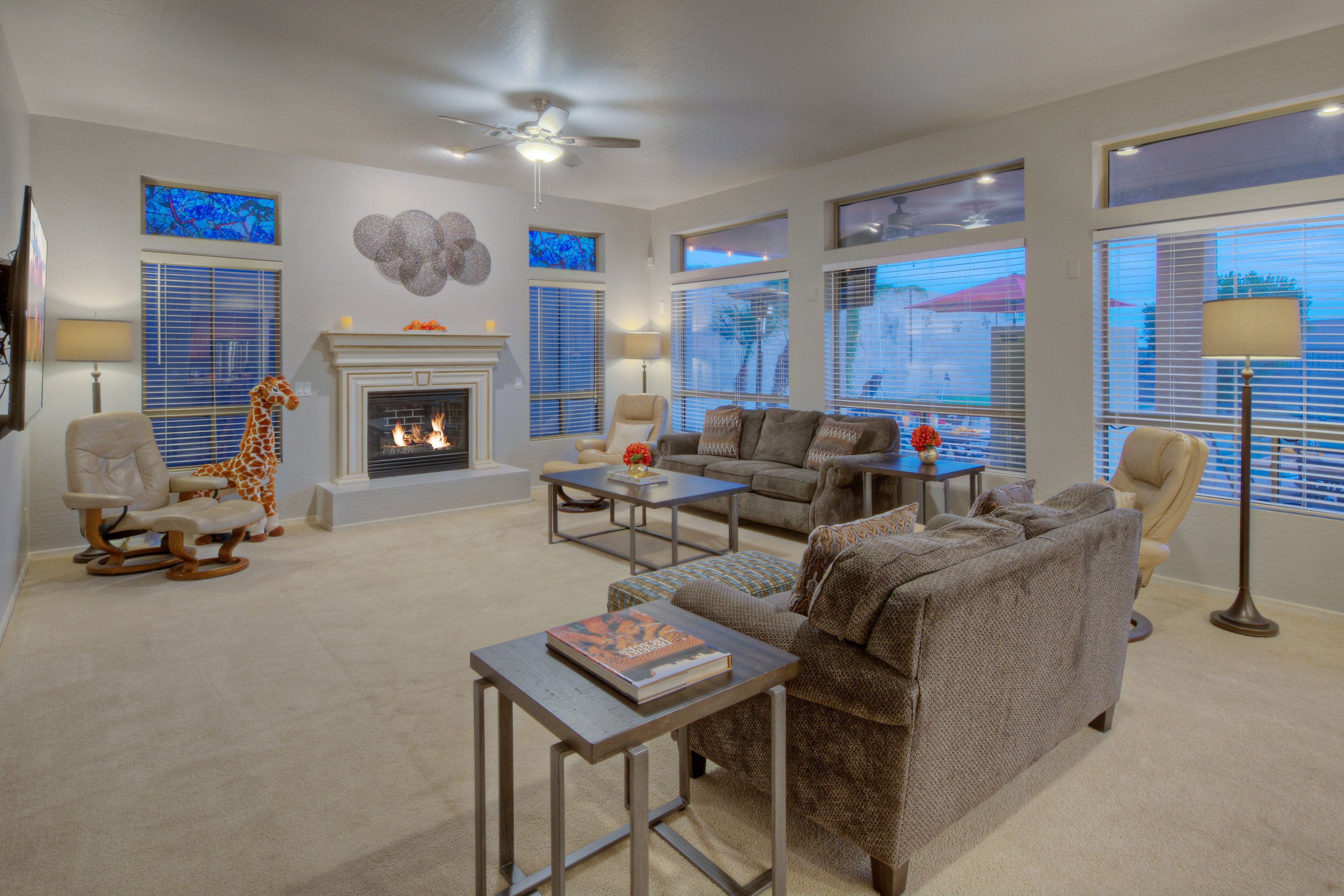 Relax in modern great room with large TV and gas fireplace.