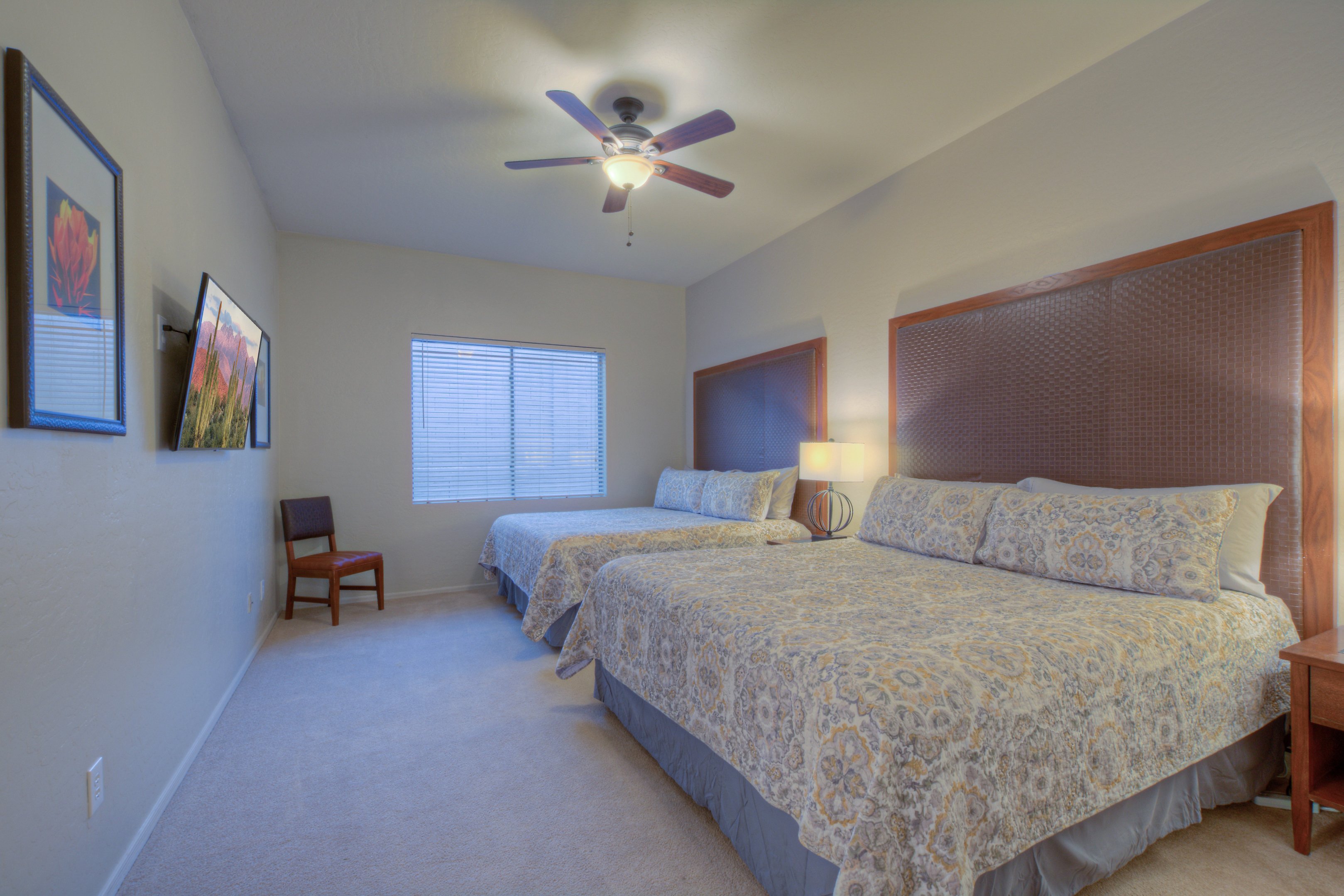 Fifth bedroom is on the ground floor and has 2 king beds, a ceiling fan and TV.