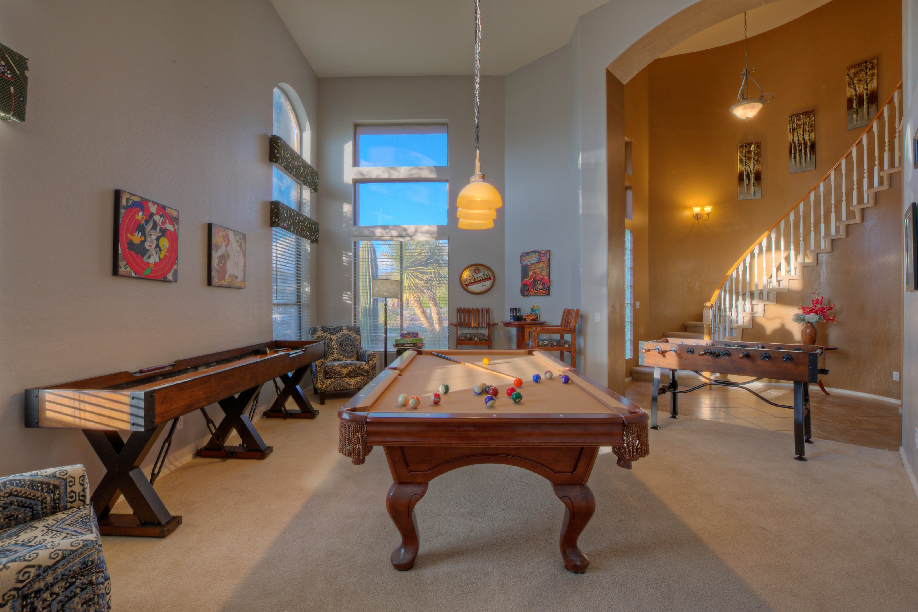 The naturally bright game room offers choices of pool, foosball, shuffleboard or Blackjack.