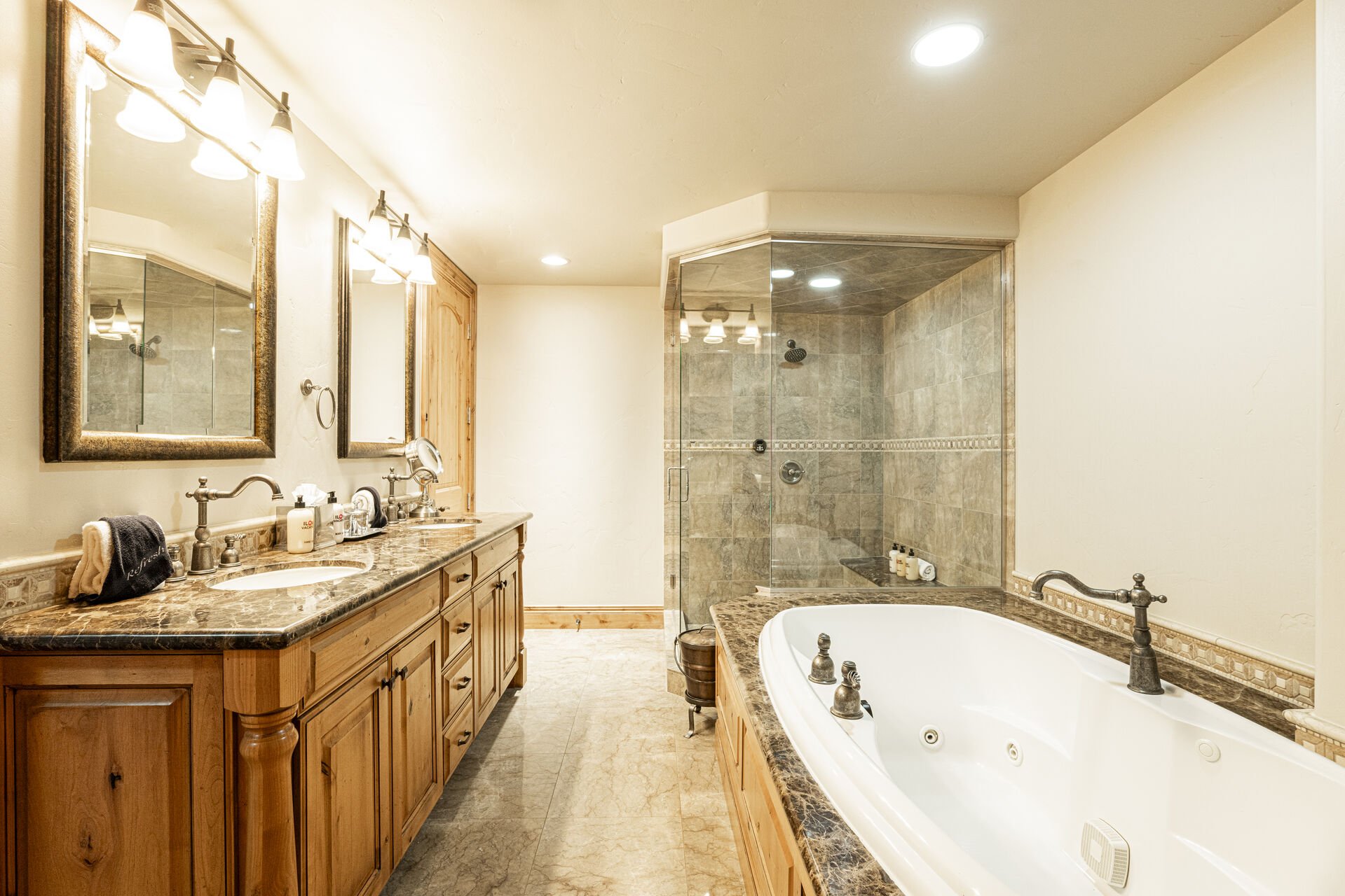 En Suite Grand Master Bath with Dual Granite Counter Sinks, Heated Floor and Steam Shower