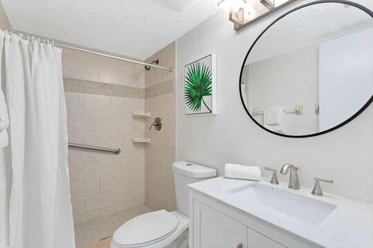 Guest bathroom with stand up shower.