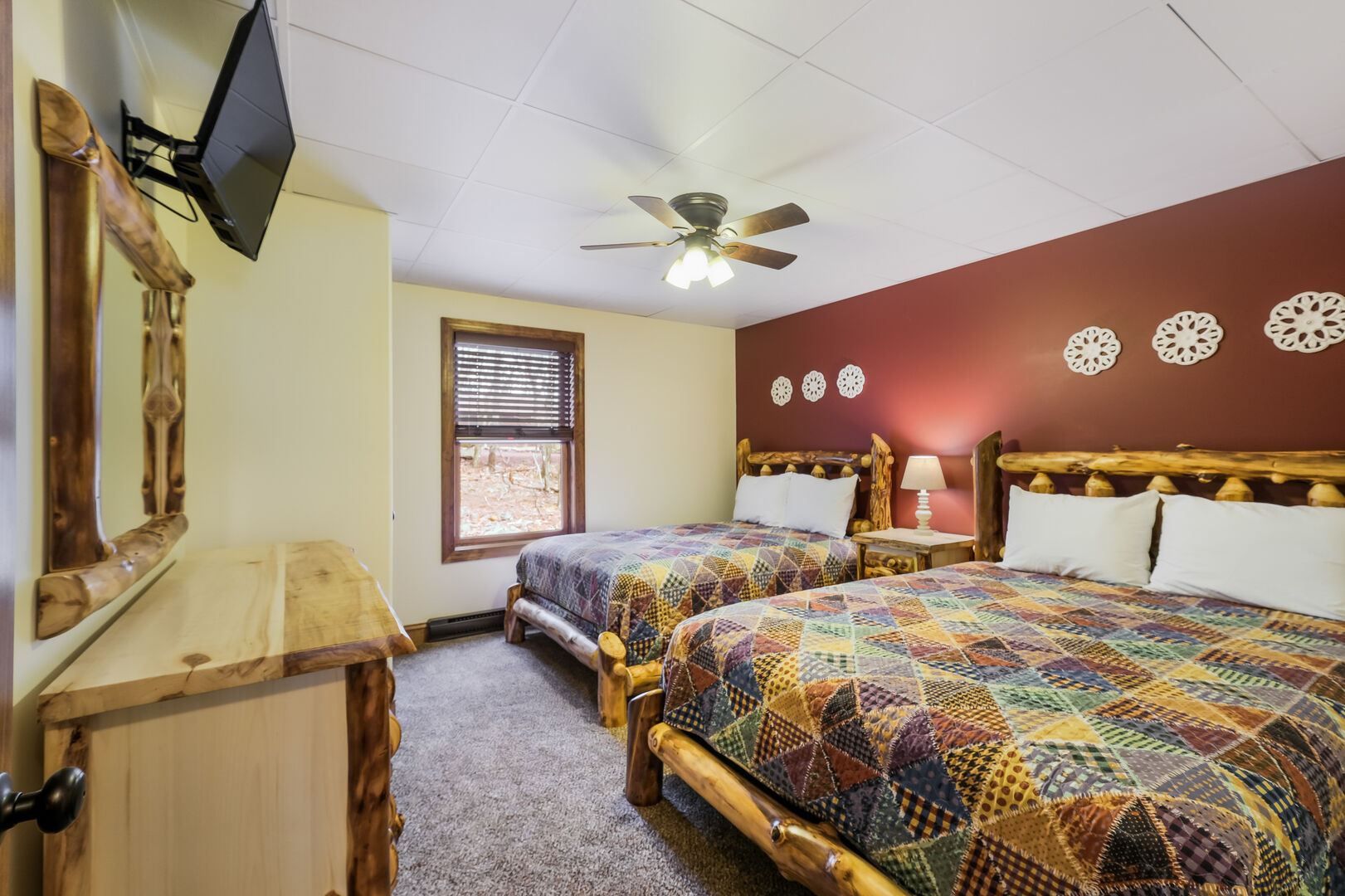 Bedroom with Two Beds, Ceiling Fan and Mounted TV