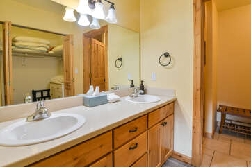 Master bathroom with two sinks and a large mirror