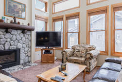 Living Room / TV / Gas Fireplace / Dining Room