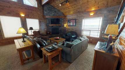 The living room has a fireplace for you to enjoy, make sure to bring your own wood.