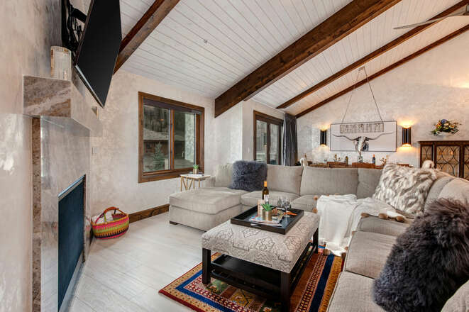 Great Room with a Vaulted Wood Beam Ceiling