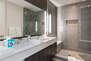 Grand Master Bathroom with Dual Sinks and LargeTiled Shower with Bench