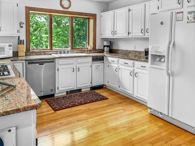 Recently refreshed Full kitchen with open concept dining, breakfast bar.  335 Meeting House Rd- Chatham- New England Vacation Rentals