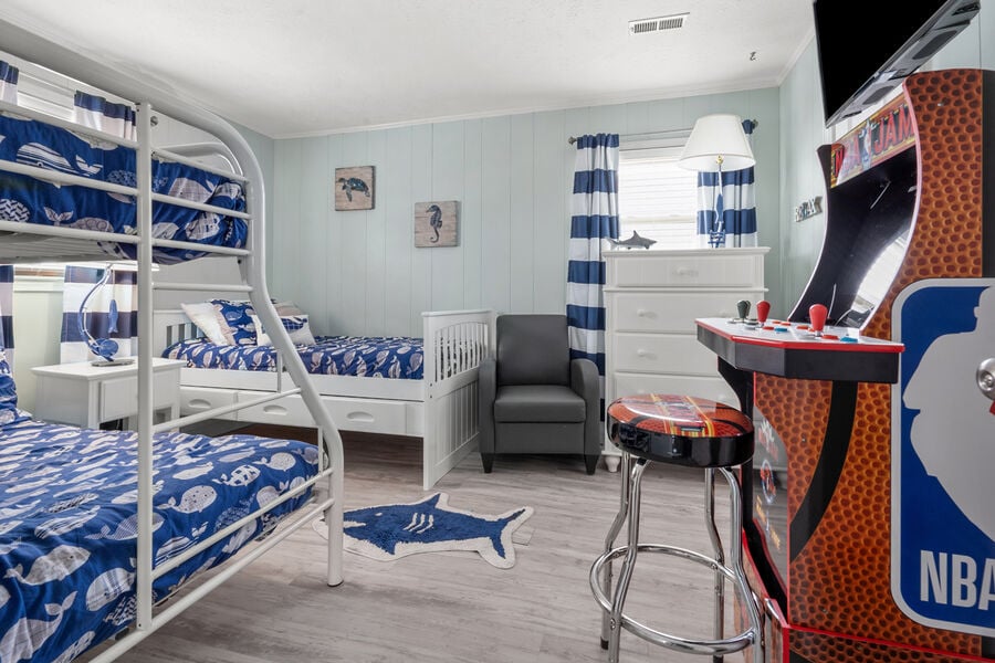 Miracle on 34th - vacation home in Cherry Grove, North Myrtle Beach | bedroom with arcade game | Thomas Beach Vacations