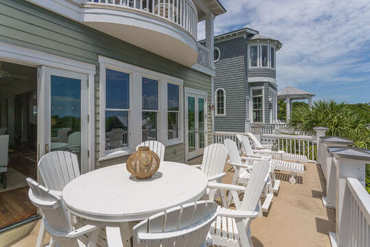 Large porch off Living Space is perfect for your group to enjoy time in the sun