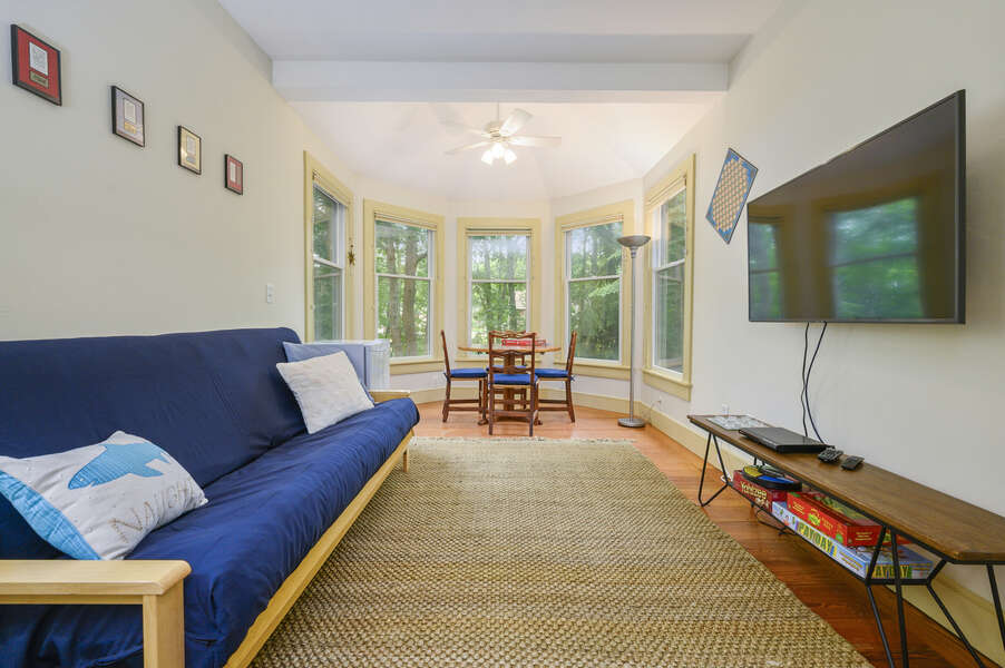 Family/game room Main Floor with Futon and Flat Screen TV - 9 Reliance Way Harwich Cape Cod - New England Vacation Rentals-#BookNEVRDirectNormasCapeEscape