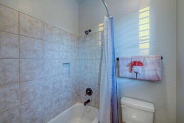 Second bath features a tub-shower combination.