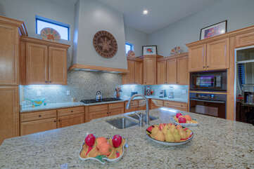 Kitchen is well equipped for prepping and serving choice cuisine.