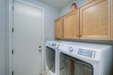 Stay ahead of your laundry chores in well stocked laundry room with family size appliances.