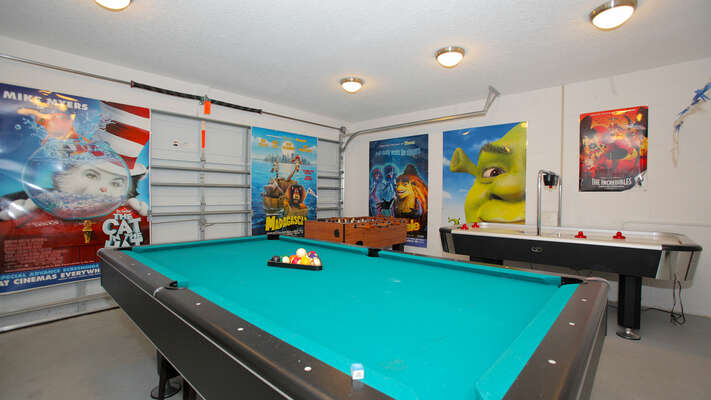 Garage converted to a games room and has pool table, air hockey and foosball.