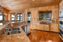 Spacious Gourmet Kitchen with a Large Center Island and Granite Counters