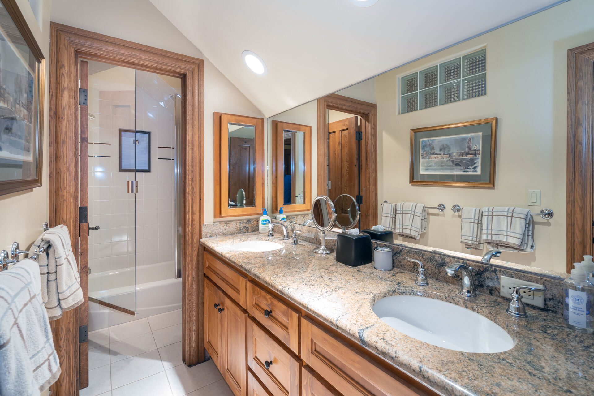 Double vanity sinks with separate shower room in this bathroom.