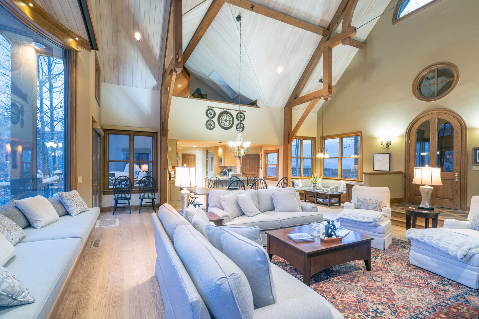 Multiple couches and armchairs in the living area of this Telluride golf rental, with a coffee table in the center.