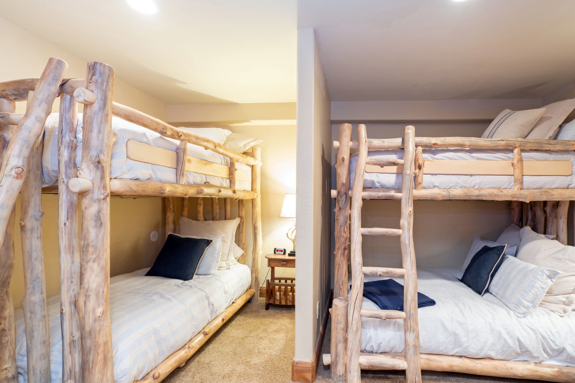 Two sets of bunk beds in a side bedroom.