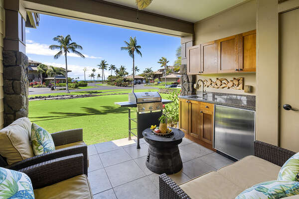 Partial ocean view from the lanai of this Hali'i Kai condo, with seating and private grill/wet bar.