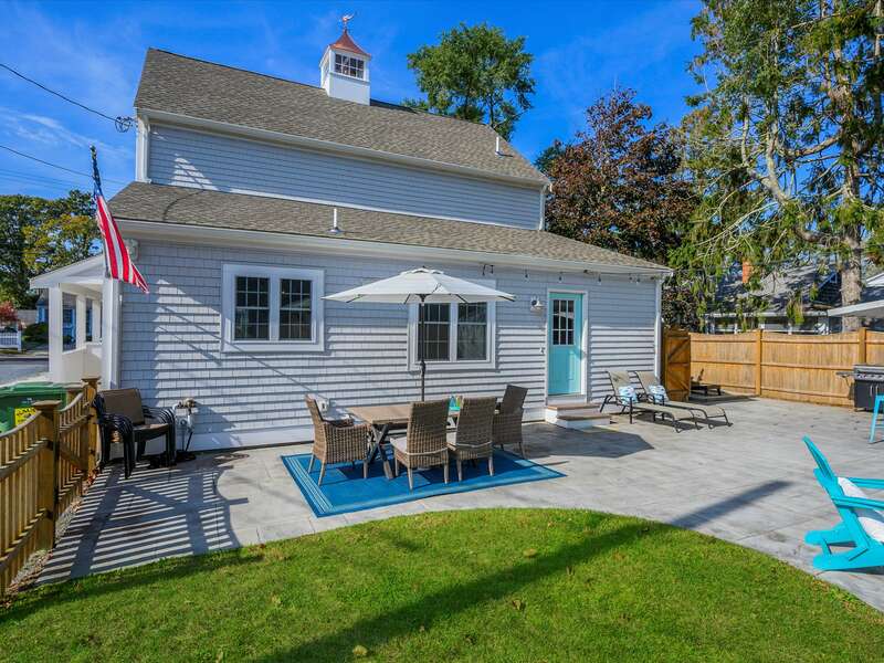 Great back yard entertainment and patio area with Corn Hole and Fire pit just to the right-58 Depot St, Dennisport, New England Vacation Rentals