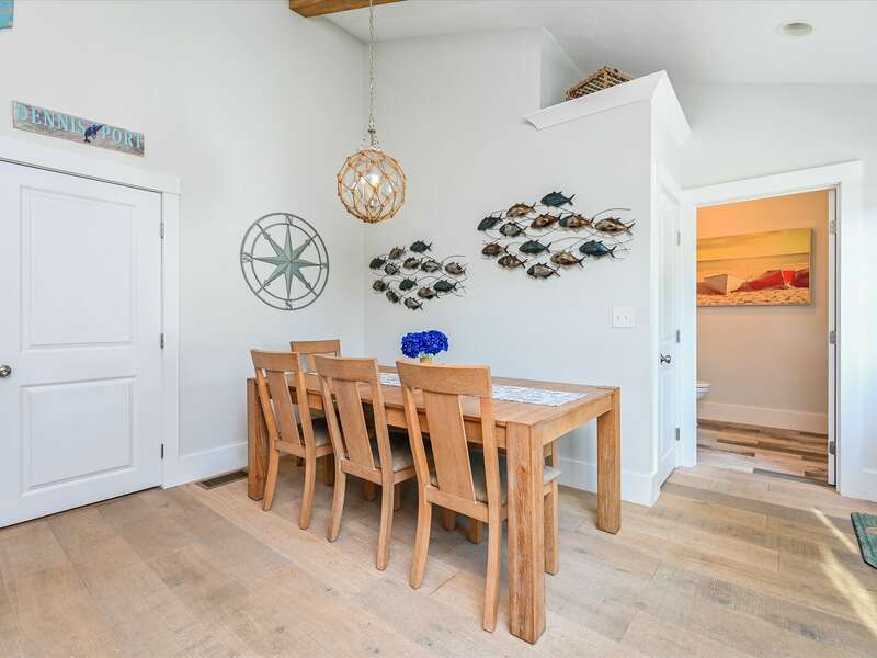 Dining area  with coastal accents and half bath entrance-58 Depot St, Dennisport , New England Vacation Rentals