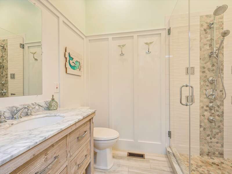 En-suite bathroom for bed room #1 with large walk in shower with rain shower head.  58 Depot St, Dennisport , New England Vacation Rentals