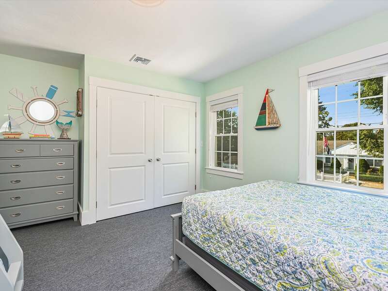 Bedroom # 2 - has a combo bunk bed / trundle with full under and twin on top, trundle pulls out to a twin bed and  additional full size bed, with carpet throughout.  58 Depot St, Dennisport , New England Vacation Rentals