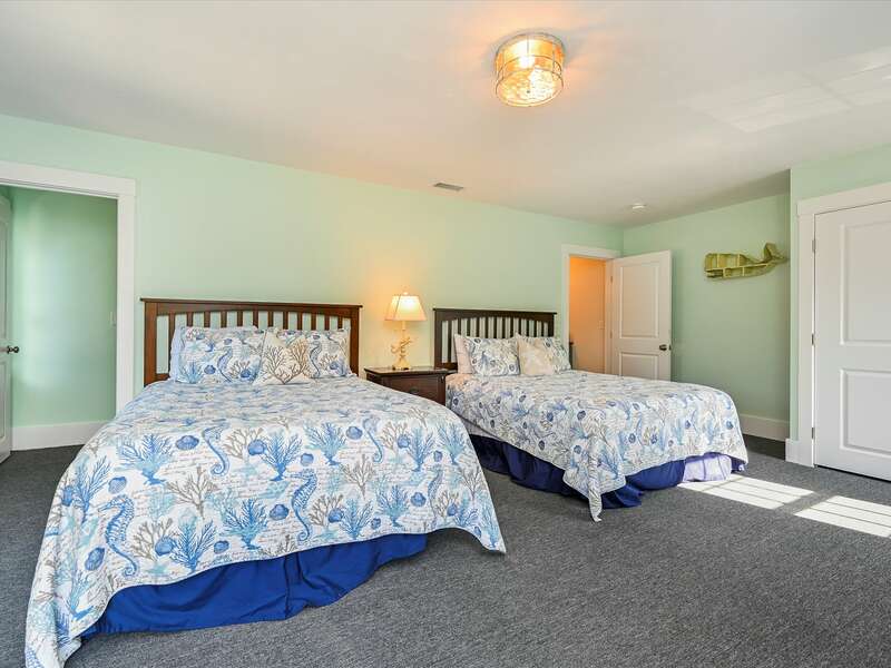 Bed room #3- This very spacious costal accented room has carpeted throughout and has 2 queen size beds with multiple dressers, nightstands and seating.  58 Depot St, Dennisport , New England Vacation Rentals