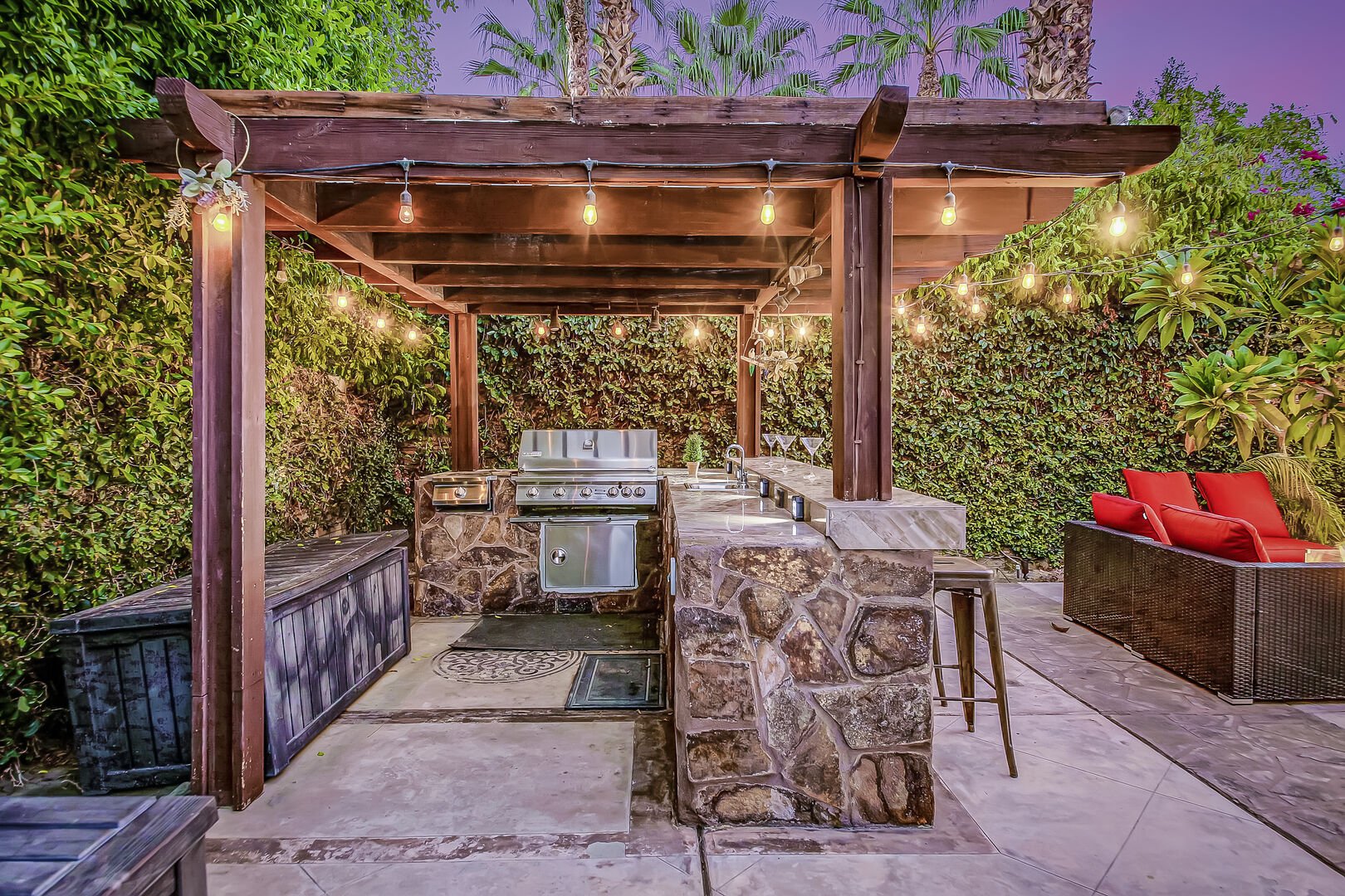 The covered outdoor kitchen with a built in barbecue is the best place to entertain.