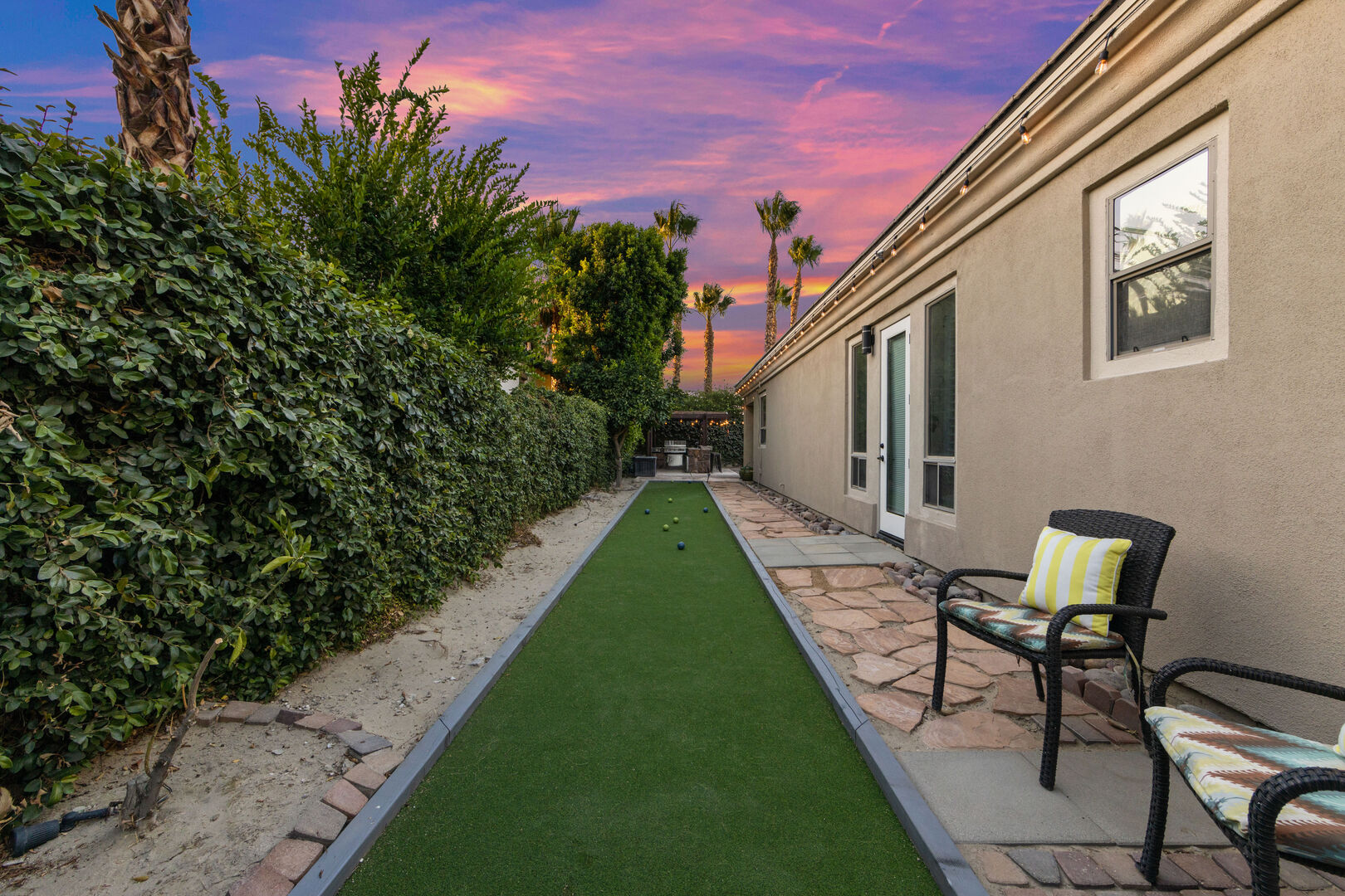 The left side of the home features a bocce ball area for you to practice your skills.