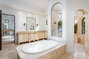Indulge in serenity as you unwind in the spacious tub within the Master Bathroom, a luxurious retreat for relaxation.