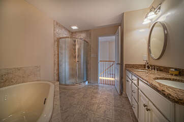Bathroom with walk in shower and nearby tub