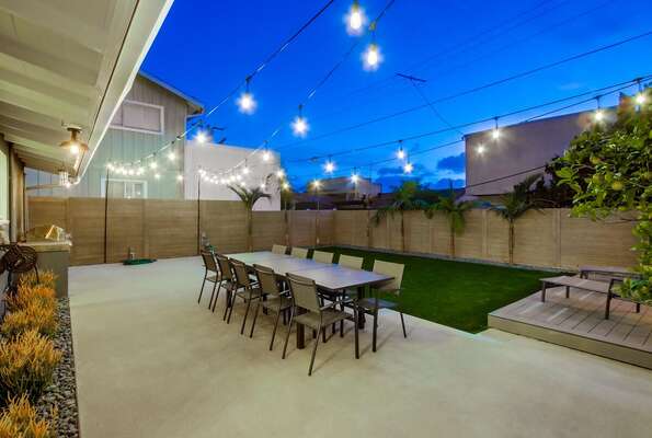Dining Table, Chairs, and String Lights in the Patio.