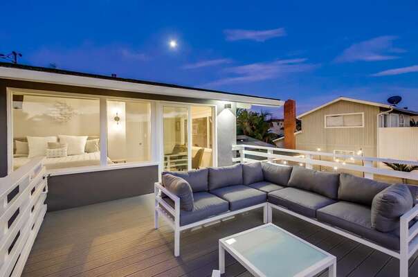 The Ocean View Balcony with Outdoor Sectional Sofa and Coffee Table.