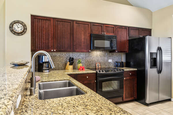 Fully Equipped Kitchen with Granite Counter Tops and Wooden Cabinets