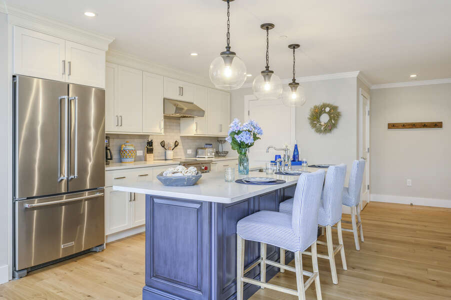Beautiful Chefs kitchen with seating for 3 at the center island with all stainless appliances.Unit 2, 557 Route 28, Harwich Port, Cape Cod, New England Vacation Rentals