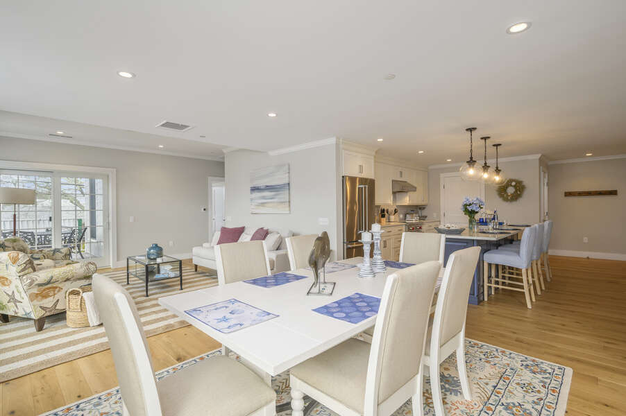Open concept dining room and Living room with entrance to private patio. Unit 202, 557 Route 28, Harwich Port, Cape Cod, New England Vacation Rentals