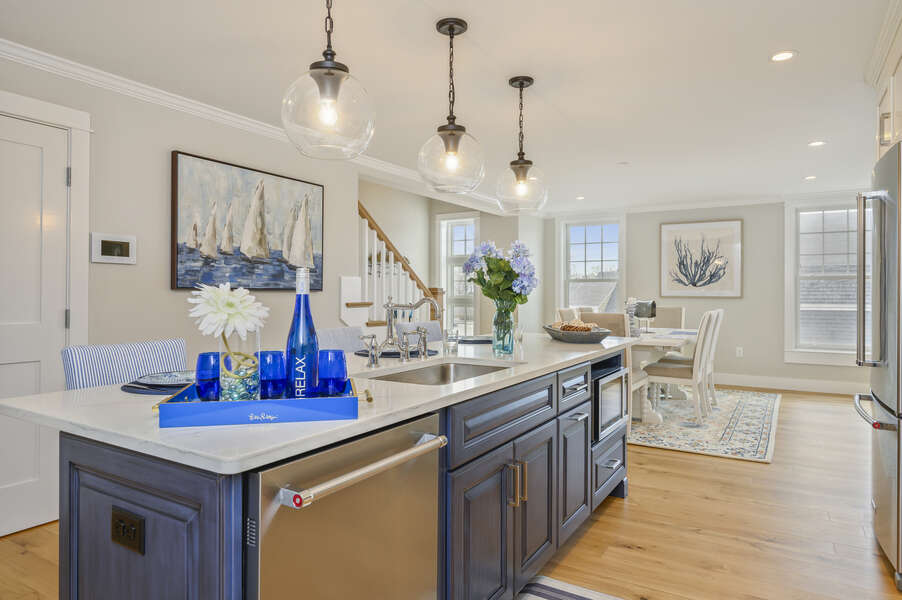 Luxury open concept kitchen and dining room with dishwasher and microwave in large island Unit 2, 557 Route 28 Harwich Port, Cape Cod, New England Vacation Rentals