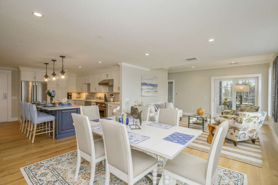 Open Concept Dining/ living area with seating for 6. Entrance to private outdoor patio.Unit 204, 557 Route 28 Harwich Port Cape Cod New England Vacation Rentals
